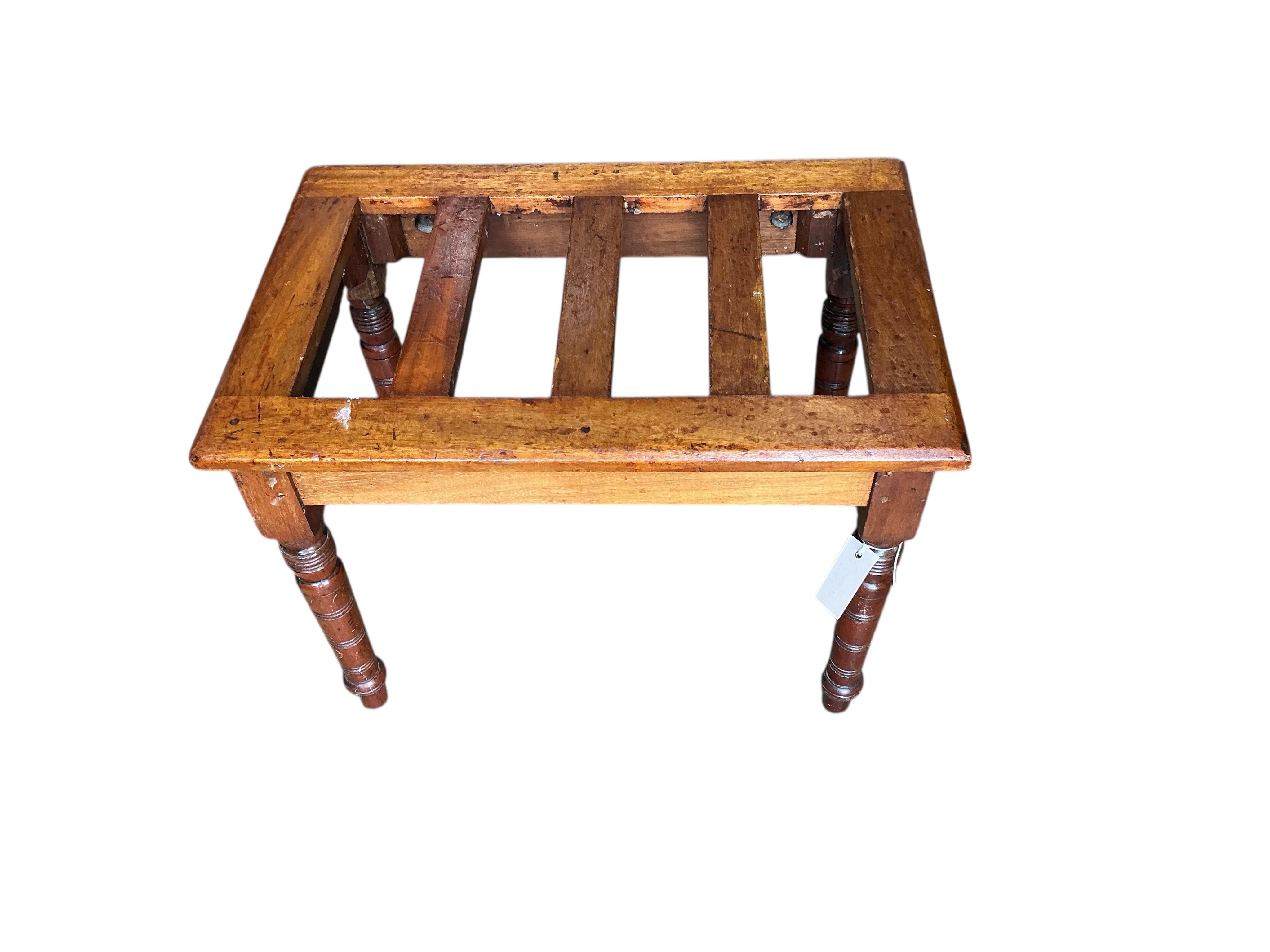 A late Victorian mahogany luggage stand, width 61cm, depth 41cm, height 46cm